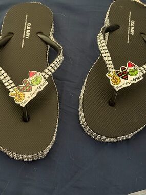 Old Navy Black Flip Flops with Rhinestone Straps and Grinch Charm